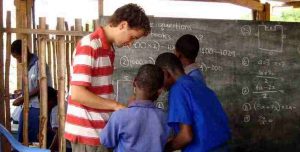 Volunteer math teacher in village school, Ghana Africa. Volunteer with sightseeing in Ghana